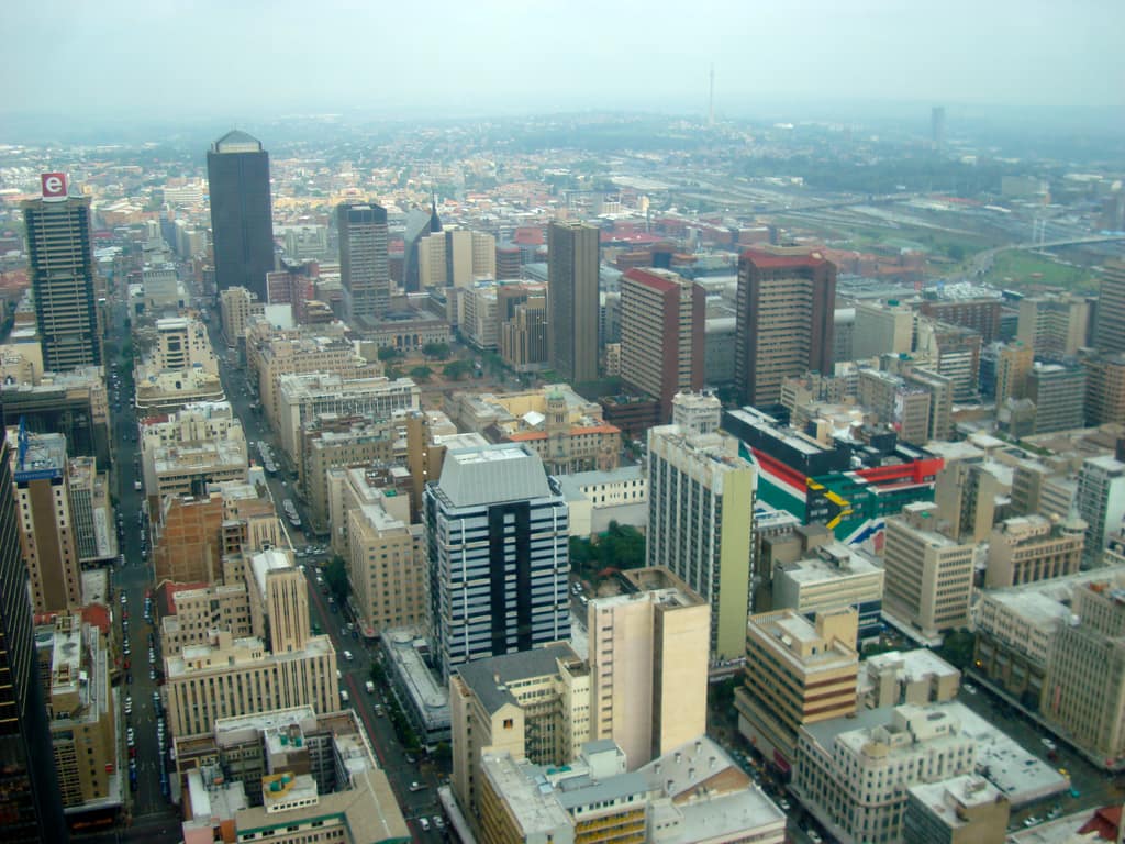 Looking down on Johannesburg's CBD from the Carlton Centre, a South African flag painted across one rooftop.