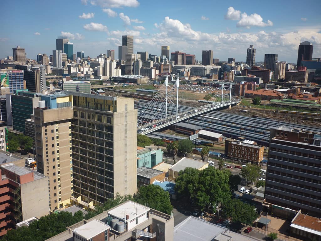 Johannesburg's CBD skyline with the Nelson Mandela Bridge crossing the rail yards.